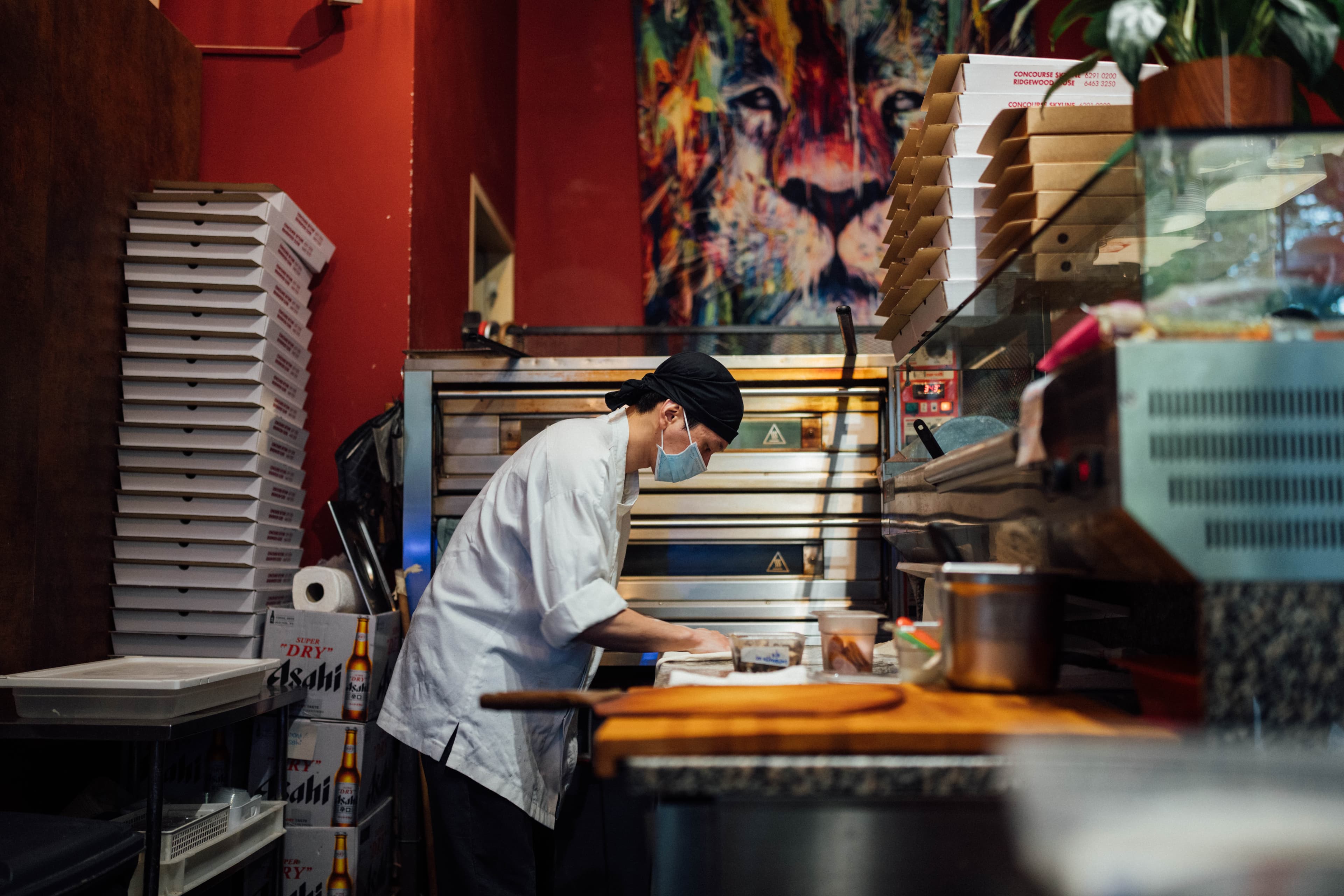 Restaurant interior with staff preparing service